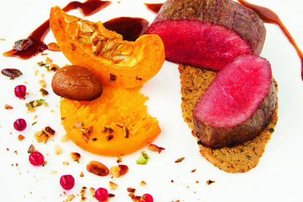 Dos de sanglier mariné au vin rouge, sauce grand veneur.